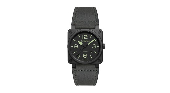 A charcoal black Bell & Ross watch with green glow in the dark hands and indices