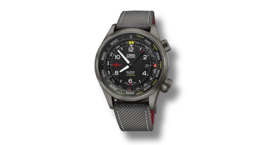 A charcoal gray Oris watch with an altimeter and gray textile strap