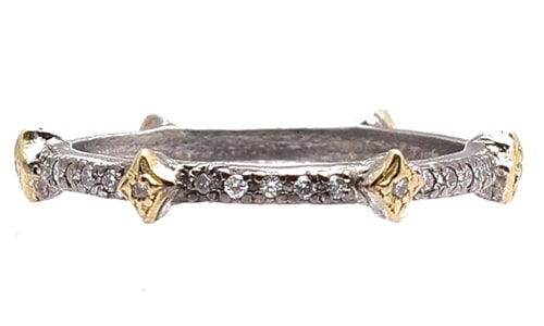 An diamond anniversary band features yellow gold and sterling silver