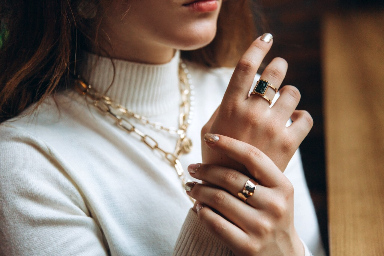 lady wearing beautiful jewelry with professional attire