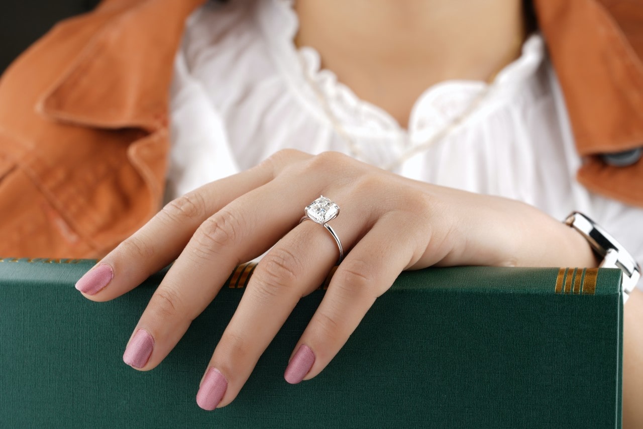 woman with engagement ring on her finger