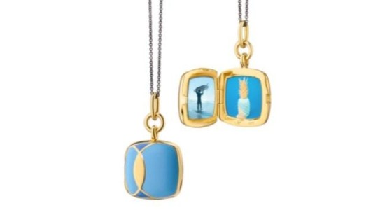 A yellow gold and blue ceramic locket necklace from Monica Rich Kosann, available at Wilson & Son Jewelers.