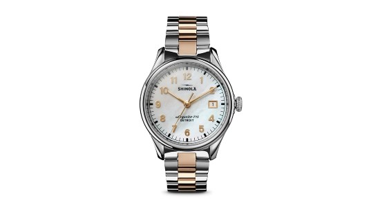a mixed metal Shinola watch featuring a mother of pearl dial