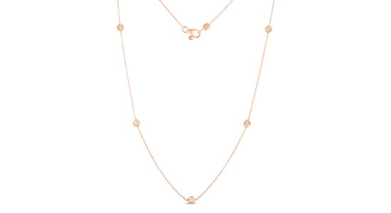 a rose gold delicate chain necklace with station, bezel set diamonds