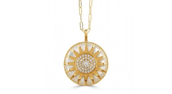 a yellow gold pendant necklace featuring a sunshine motif studded with diamonds