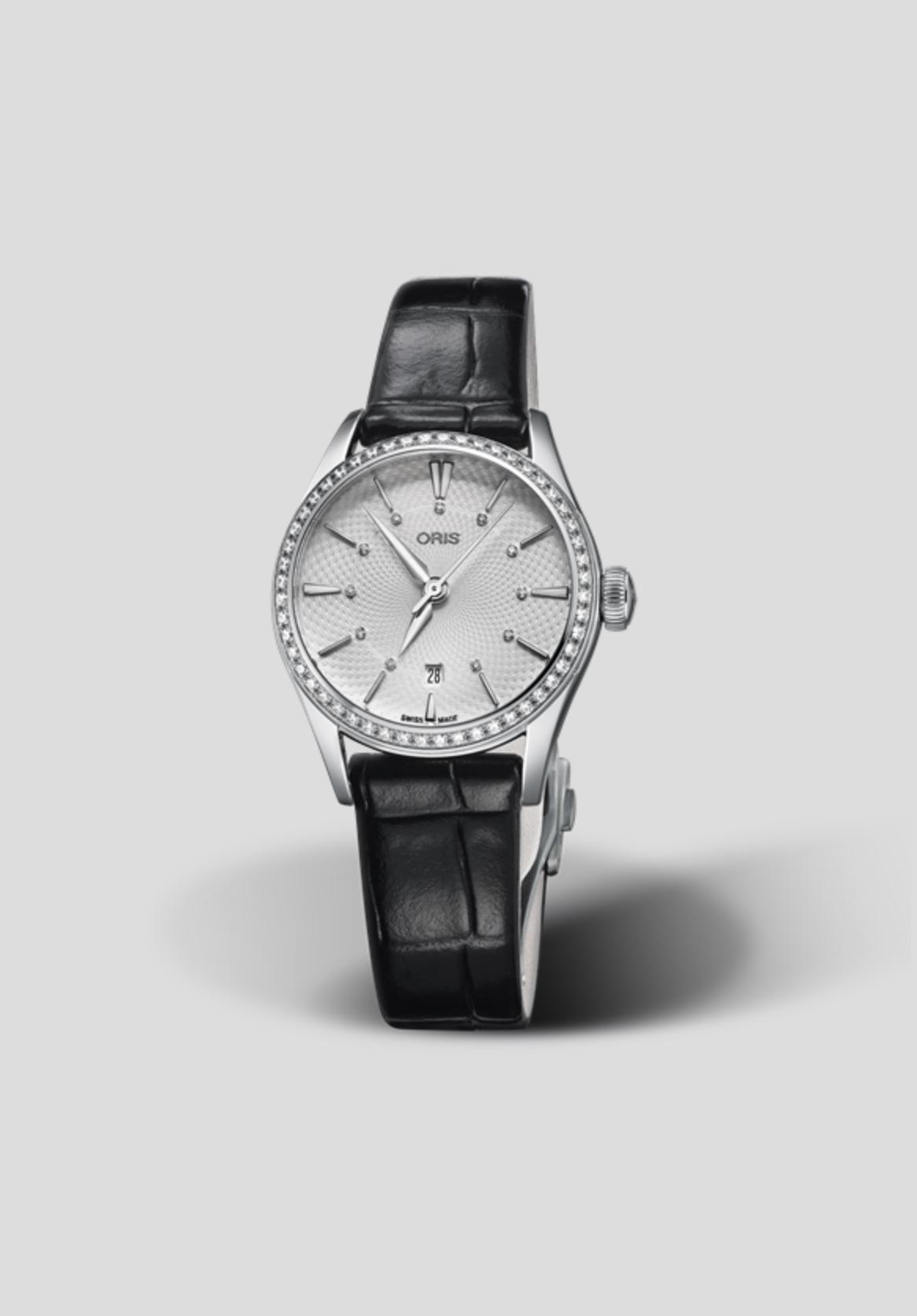 The Oris watch with black leather strap and white dial
