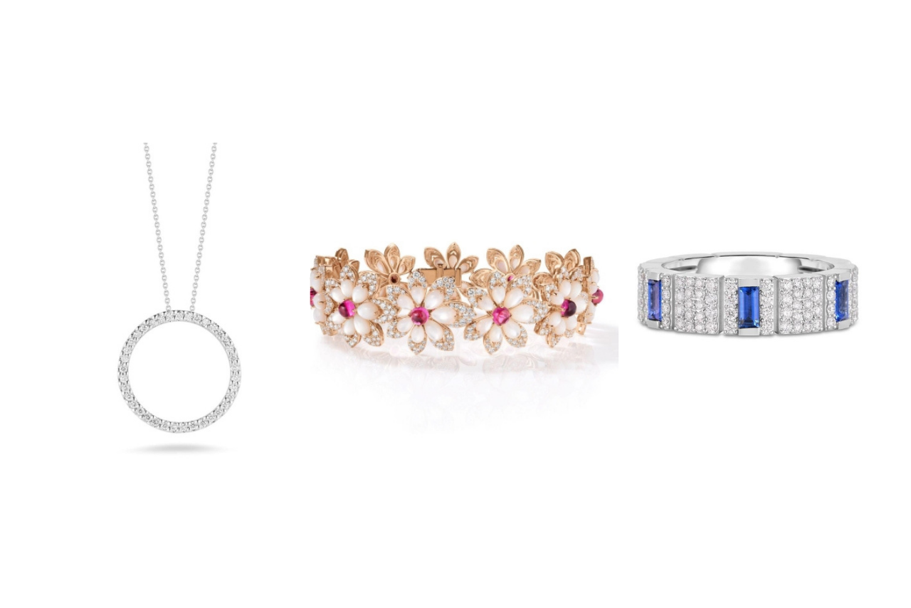 A round diamond necklace, yellow gold floral bracelet with rubies and diamonds, white gold ring with emerald cut blue sapphires and diamond encrusted band