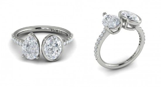 A white gold toi et moi engagement ring with a pear shape and oval cut diamond, available at Wilson & Son Jewelers.