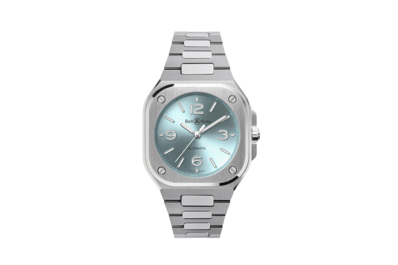 A silver watch with a square bezel and a dazzling ice blue dial.