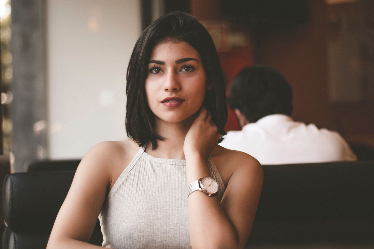 lady sitting down indoors wearing a dress watch