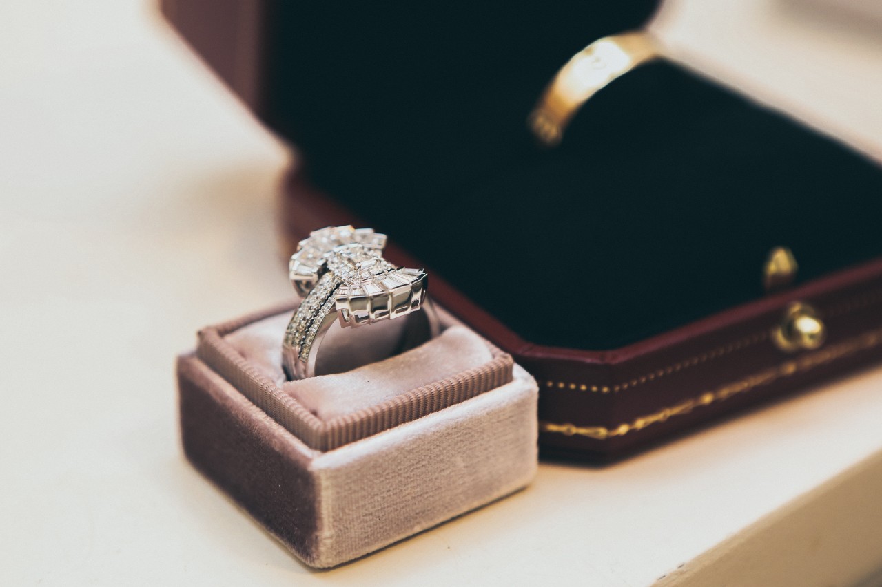 An Art Deco engagement ring in a pink ring box. An Art Deco engagement ring in a pink ring box.